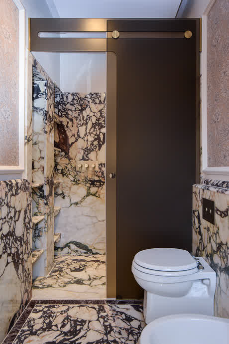 sliding shower enclosure with bronze glass and trackless system