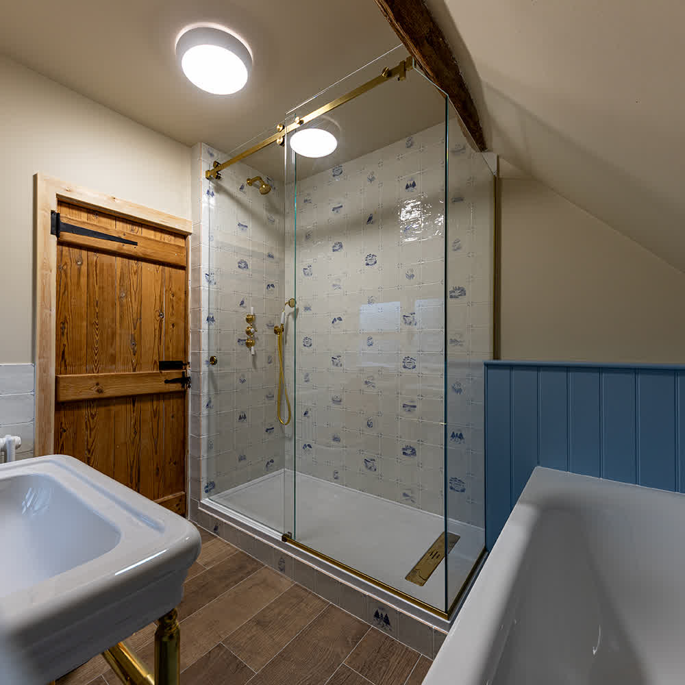 sliding door enclosure with brass track