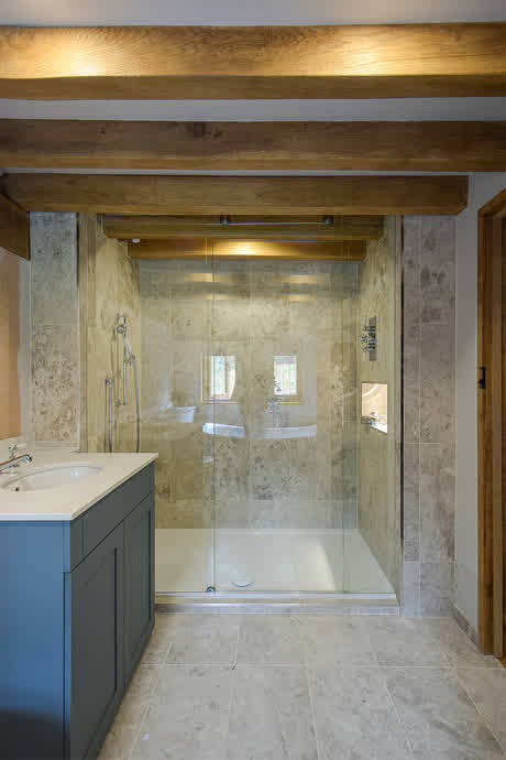 sliding shower door and a panel without a sliding track