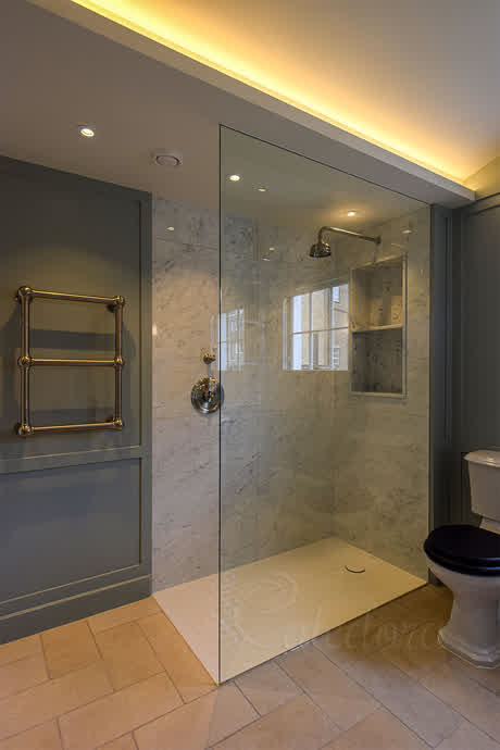 full height shower panel recessed in the ceiling and wall