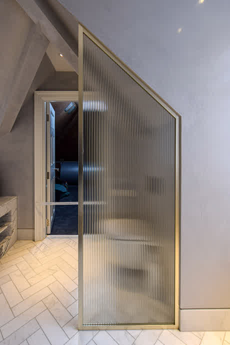 nickel framed screen with reeded glass and sloped ceiling